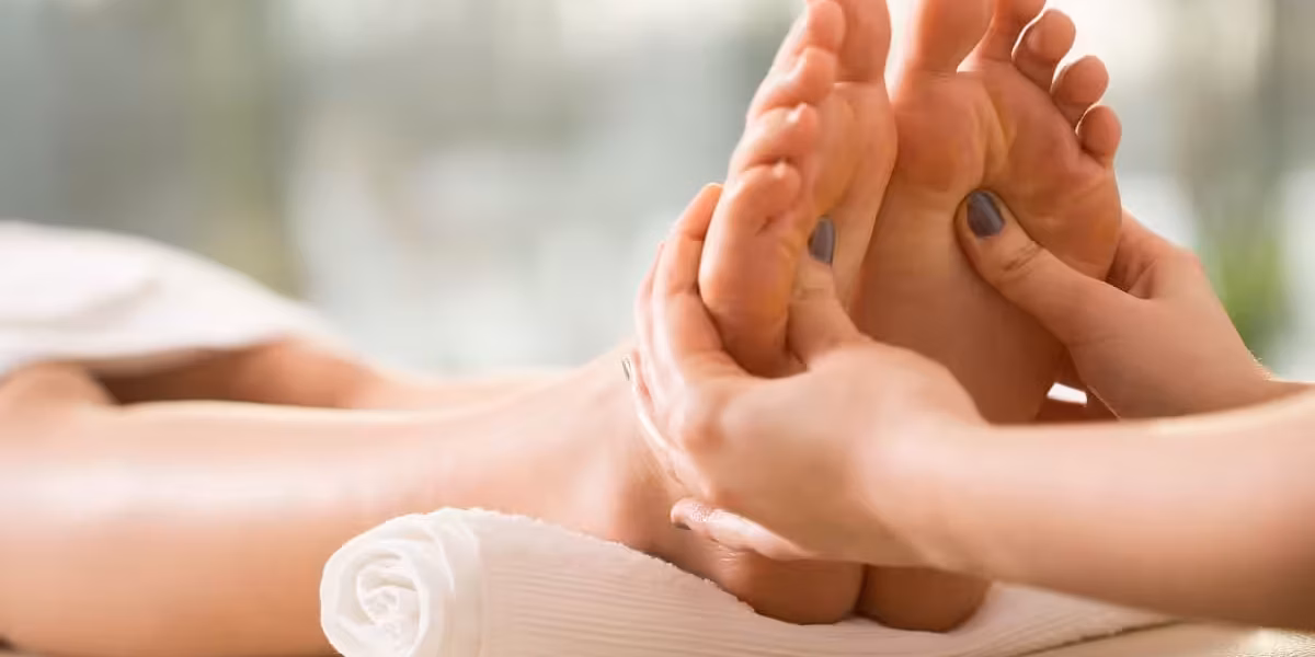 Close-up of young woman having reflexology